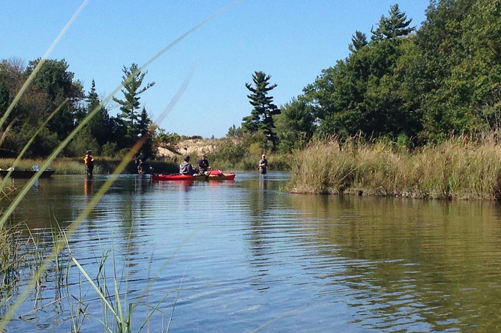 https://www.canoemichigan.com/wp-content/uploads/2019/06/platte-river-fishing.jpg